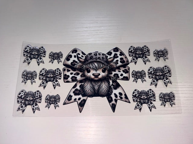 Black and White Cow with Bow