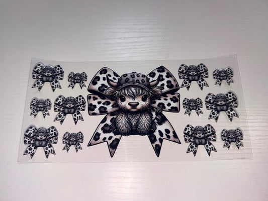 Black and White Cow with Bow